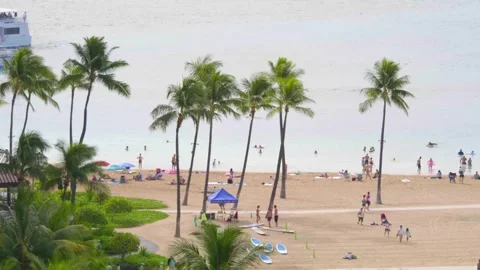 Calm beach scene with distant sailboats on the Honolulu shoreline in 4k slo.. Stock Footage 288564112