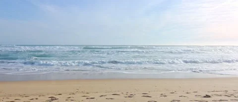 Calm beach waves in sunny day, steady shot Stock Footage 212460869