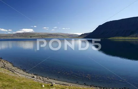 Calm blue lake Stock Photos