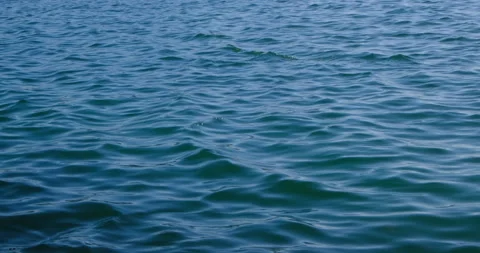 Calm blue ocean surface with gentle waves in summer. Relaxing and peaceful. Stock Footage 131104411