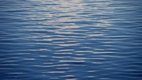 Calm Blue Ocean Water Surface with Gentle Ripples and Sunlight Reflections. Stock Footage 340188967