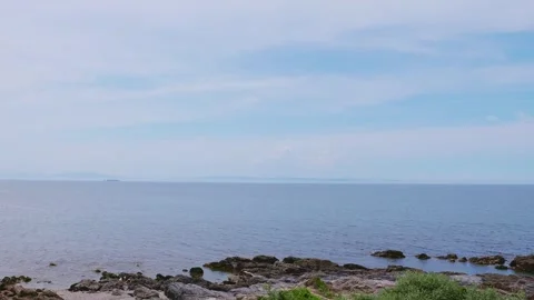 Calm blue sea and distant cargo ship in Saganoseki, Oita Stock Footage 337073152