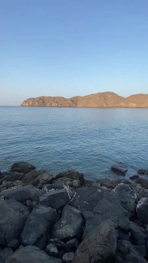 Calm blue sea, rocks. Vertical video Stock Footage 281262094