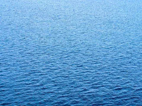 Calm blue sea with wavelets. Backgrounds. Stock Photos