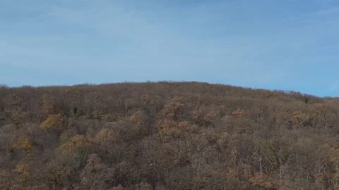 Calm Blue Sky Above Rolling Hills at Dawn Aerial View Stock Footage 324889949