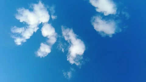 Calm blue sky with soft white clouds moving gently. Stock Footage 337883387