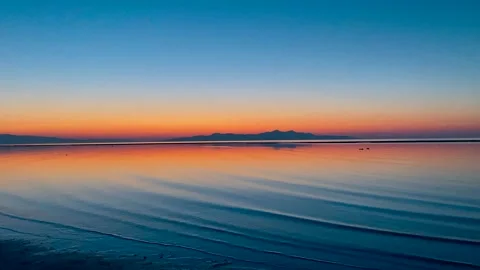 Calm blue waves at sunset Stock Footage 160924296