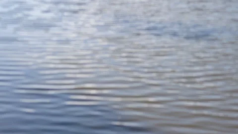 Calm blurred water surface background Video stock 240691147