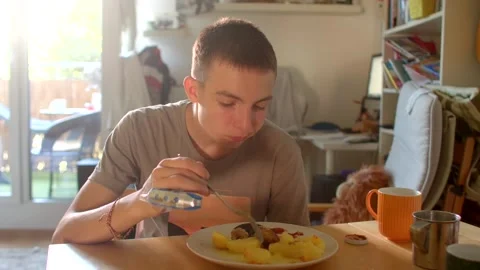 Calm breakfast reflection, Silent morning scene with thoughtful young Stock Footage 320956587