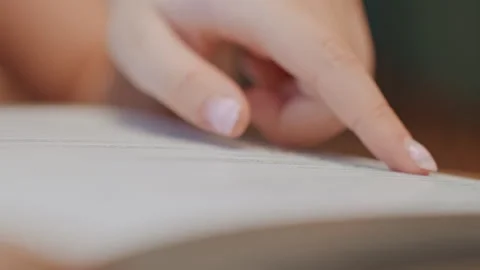 Calm classroom with focused student practicing reading. Concentrated student Stock Footage 341666660