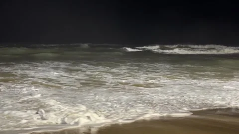 Calm coastal ocean waves at night in Da Nang, Vietnam Video stock 323928779