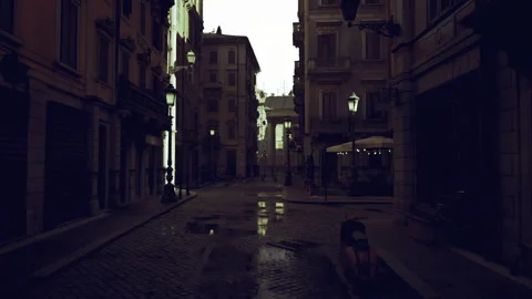 Calm dawn scene featuring vacant shops and shining wet stones Stock Footage 340655097