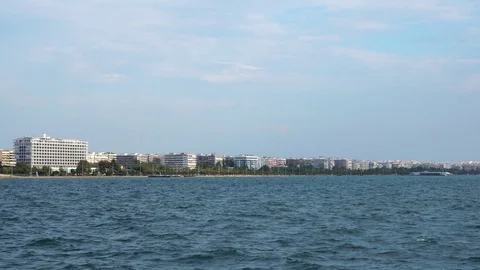 Calm deep blue waves in ancient Greece port city Thessaloniki in sunny summer Stock Footage 95393125