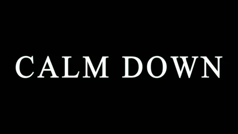 Calm Down text with subtle green glow in a clean dark setting for stress re.. Stock Footage 345621871