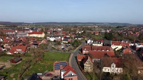 Calm drone flight above historic German town with red tile rooftops, villas and Stock Footage 331986499