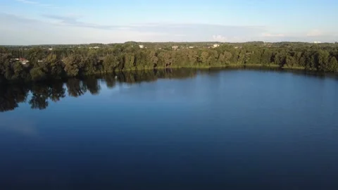 Calm Drone Flight Over Sunny Lake in Summer Stock-Footage 328534619