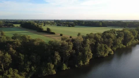 Calm Drone Flight Over Sunny Lake in Summer Stock Footage 328534831