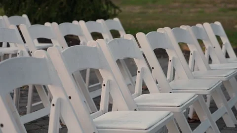 Calm Dusk Scene With Arranged Seating, Quiet Chairs Aligned On Lawn Before Stock-Footage 323771677