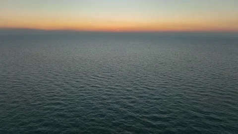 Calm, empty ocean with sunlit horizon Stock Footage 345522351