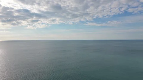Calm Endless Ocean Horizon Beneath Dramatic Cloudy Sky Aerial Drone View Vidéo 334919518
