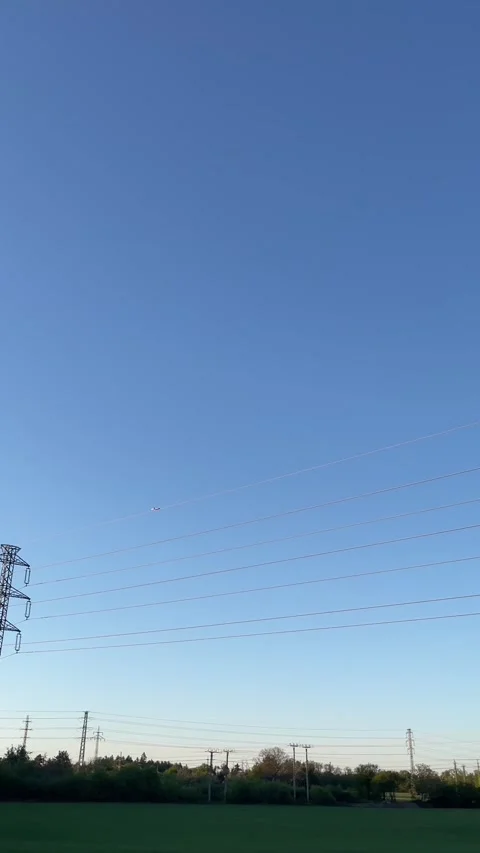 Calm evening scene featuring energy infrastructure and open nature Stock Footage 341671742