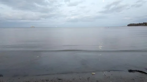 Calm Evening Sea With Moon Reflection on Shore Stock Footage 335401408