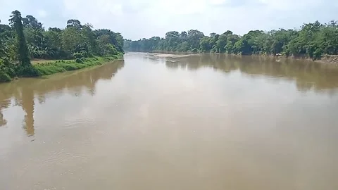 The calm flow of the Ogan river keeps a story 스톡 동영상 243165446