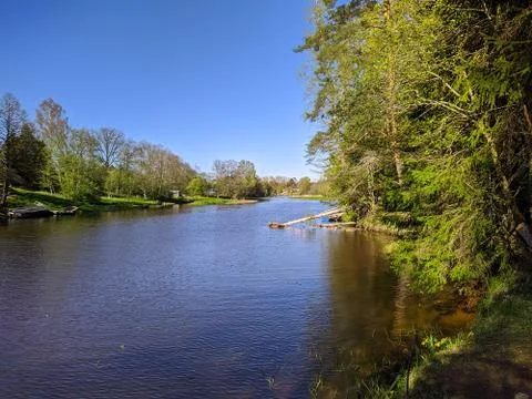 Calm flow of the river in the daytime Stock Photos