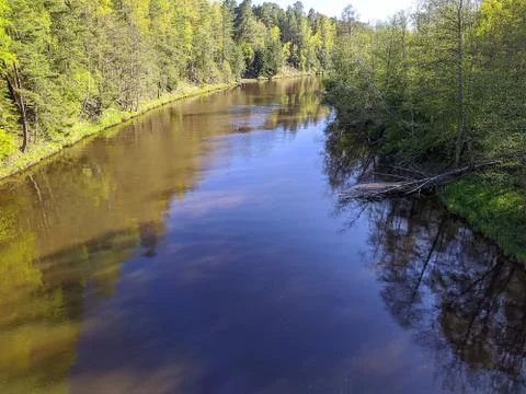 Calm flow of the river in the daytime Stock Photos