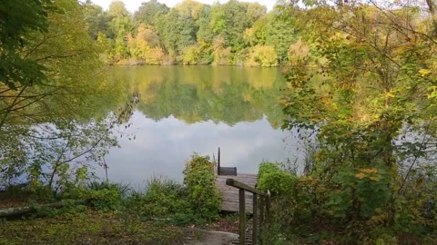 The calm flow of the river. Reflection in the water of the sky and trees. Stock Footage 218140772