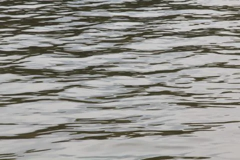 Calm gray river waves Stock Photos