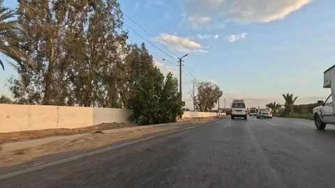 Calm highway drive along Cairo Fayoum Desert Road wide desert horizon views Stock Footage 330114948
