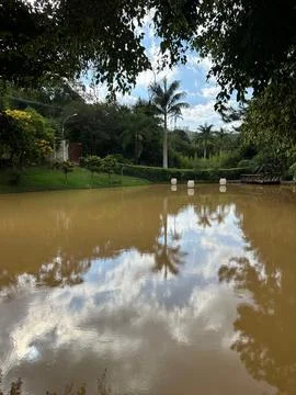 Calm lagoon with reflections of clouds Stock Photos