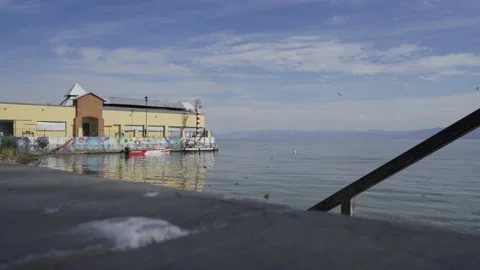 Calm lake and floating building Video stock 149076882