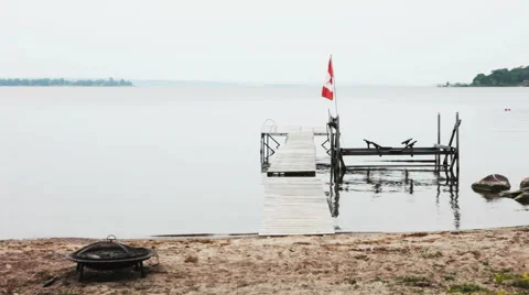 Calm Lake Beach on a Cloudy Day in Georgian Bay Canada Stock Footage 50990044