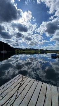 Calm lake with dramatic clouds Foto stock