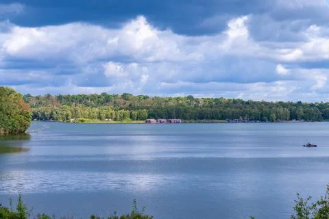 Calm Lake Landscape Under Dramatic Clouds Stock Photos