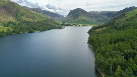 Calm lake mirrors distant peaks Stock Footage 345523414