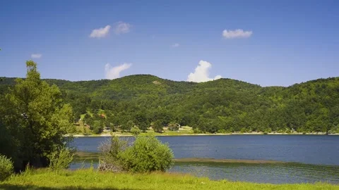 Calm lake with mountains in the background Stock Footage 137207011