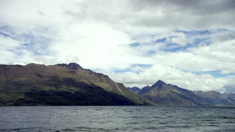 Calm lake with mountains Stock Footage 159754709