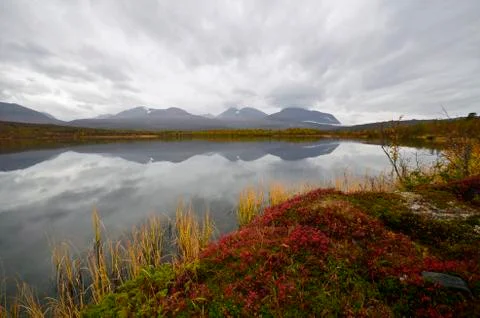 Calm lake reflection Stock Photos