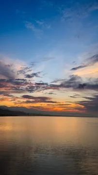 Calm Lake at Sunset with Clouds 스톡 사진
