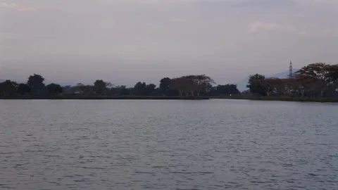 Calm lake view during late afternoon twilight and sunset in nature Video stock 345653466