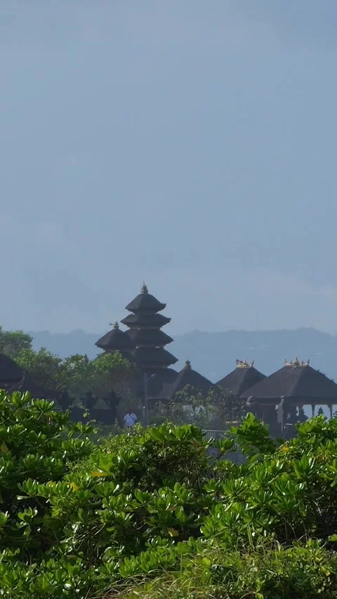Calm Landscape Featuring Lush Trees And Distant Sacred Structures Stockbeeldmateriaal 330974489