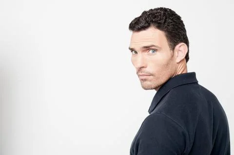 Calm man looking back over his shoulder Stock Photos