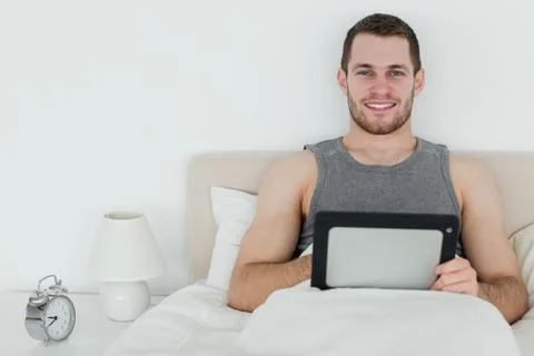 Calm man using a tablet computer Stockfoto's