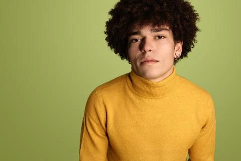 Calm man in yellow pullover Stock Photos