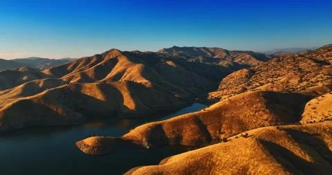 Calm mesmerizing scenery of mountains going deep to the water.  Stock Footage 250428733