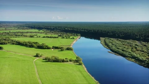 The calm mirror-like smoothness of the riverbed, the sky reflected in the water Stock Footage 257784670