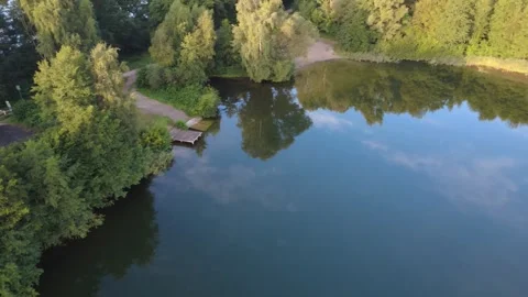 Calm Morning Drone Flight Over Lake with Water Reflections Stock Footage 328521908